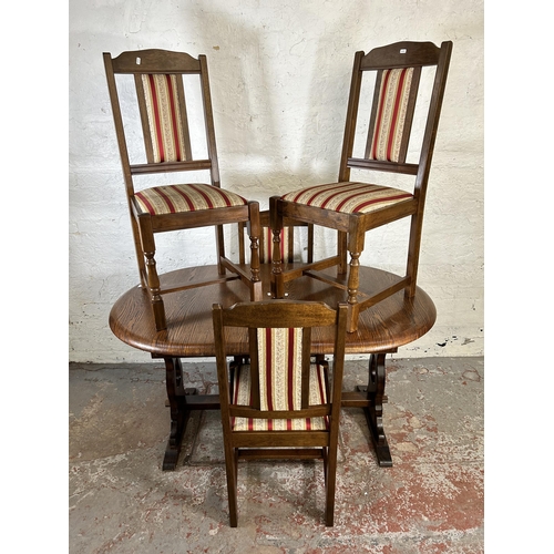 53 - An oak oval extending dining table and four matching dining chairs - approx. 76cm high x 88cm wide x... 