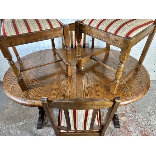 53 - An oak oval extending dining table and four matching dining chairs - approx. 76cm high x 88cm wide x... 