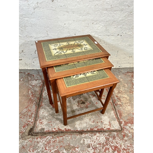 61 - A teak tiled top nest of three tables - approx. 49cm high x 56cm wide x 40cm deep