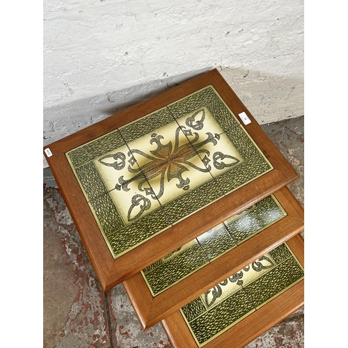 61 - A teak tiled top nest of three tables - approx. 49cm high x 56cm wide x 40cm deep