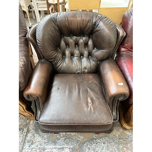 68 - A brown leather Chesterfield rocking armchair