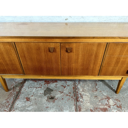 77 - A teak sideboard with three drawers and three cupboard doors - approx. 75cm high x 198cm wide x 45.5... 