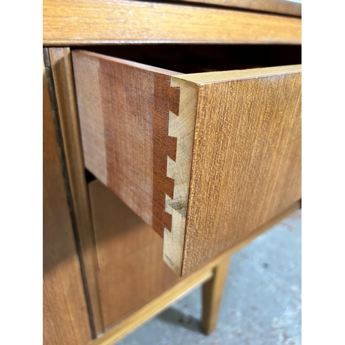 77 - A teak sideboard with three drawers and three cupboard doors - approx. 75cm high x 198cm wide x 45.5... 