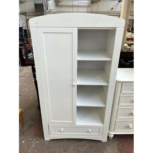 81 - A modern white painted child's wardrobe with four shelves, single door and lower drawer - approx. 17... 