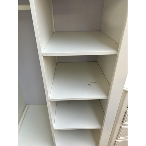 81 - A modern white painted child's wardrobe with four shelves, single door and lower drawer - approx. 17... 