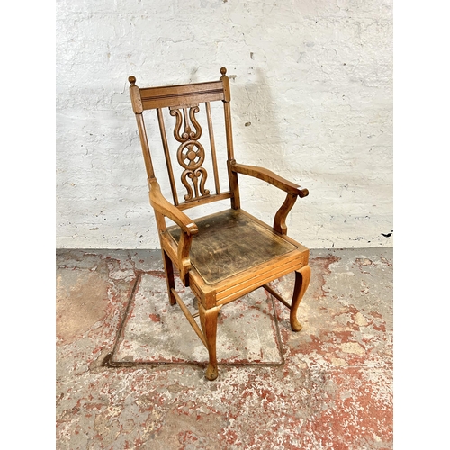 82 - A mid 20th century elm and beech armchair with carved fretwork back and cabriole supports - approx. ... 