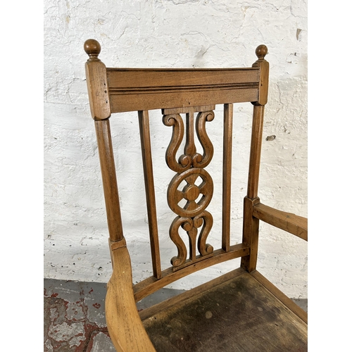 82 - A mid 20th century elm and beech armchair with carved fretwork back and cabriole supports - approx. ... 