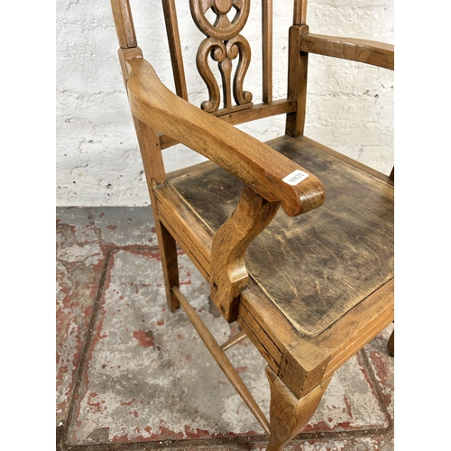 82 - A mid 20th century elm and beech armchair with carved fretwork back and cabriole supports - approx. ... 