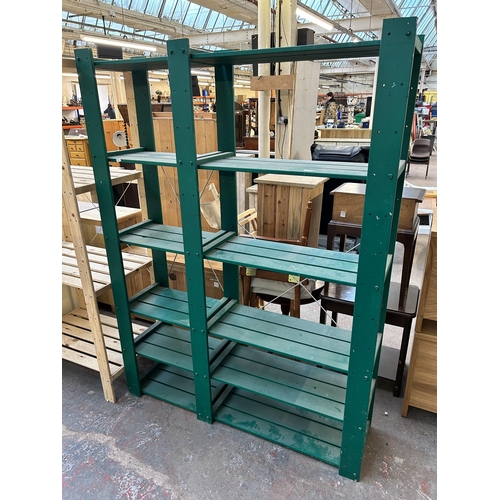 85 - Two wooden shelving units, one green painted - approx. 175cm high x 130cm wide x 34cm deep and one p... 