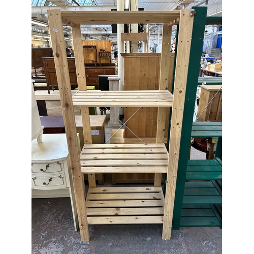 85 - Two wooden shelving units, one green painted - approx. 175cm high x 130cm wide x 34cm deep and one p... 