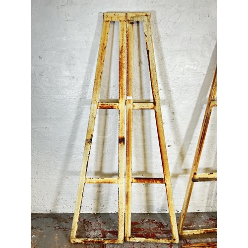 9 - An industrial metal three tier shelving unit with wooden shelves - approx. 184cm high