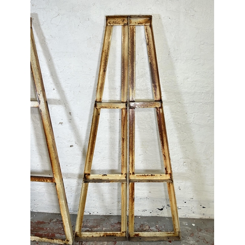 9 - An industrial metal three tier shelving unit with wooden shelves - approx. 184cm high