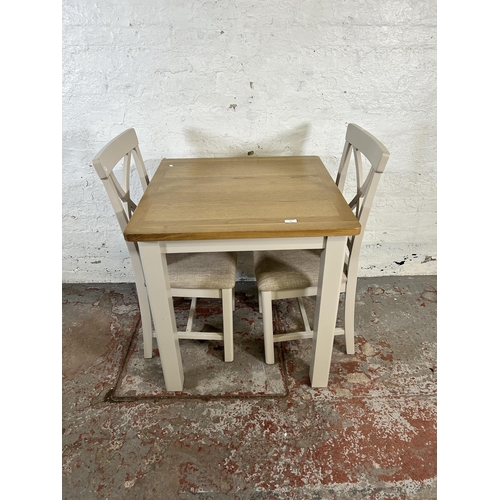 90 - A modern oak and grey painted square dining table and two matching dining chairs - approx. 79cm high... 