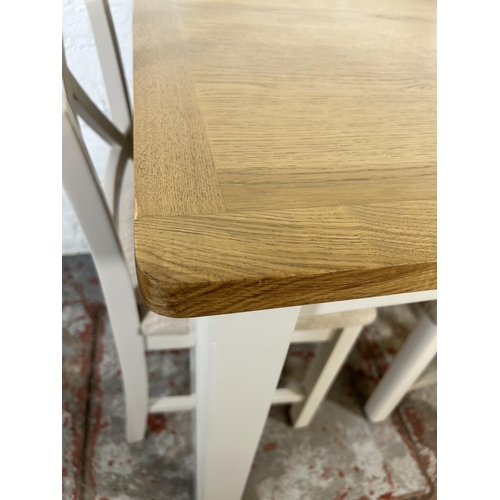 90 - A modern oak and grey painted square dining table and two matching dining chairs - approx. 79cm high... 