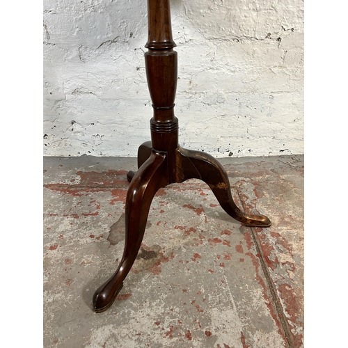 91 - A 19th century mahogany circular tripod occasional table - approx. 70cm high x 62cm diameter