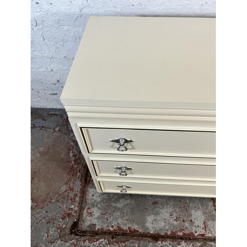 93 - A white laminate chest of three drawers - approx. 76cm high x 75cm wide x 44cm deep