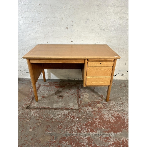 94 - A mid 20th century Burndale oak office desk with three drawers - approx. 73cm high x 120cm wide 67cm... 