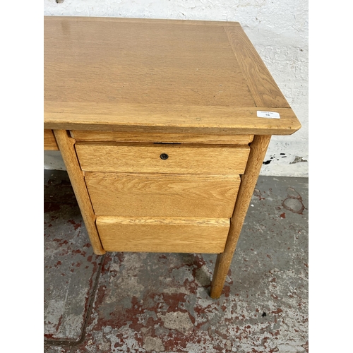 94 - A mid 20th century Burndale oak office desk with three drawers - approx. 73cm high x 120cm wide 67cm... 