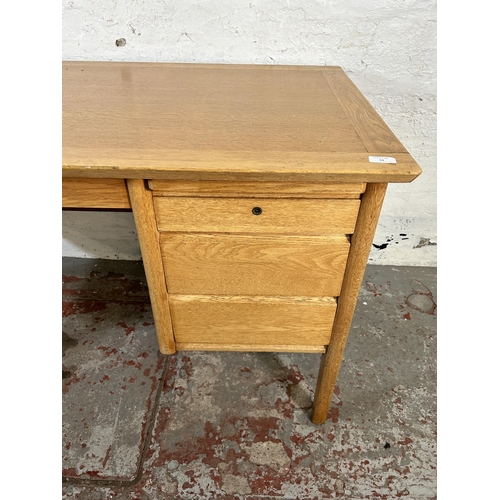 94 - A mid 20th century Burndale oak office desk with three drawers - approx. 73cm high x 120cm wide 67cm... 