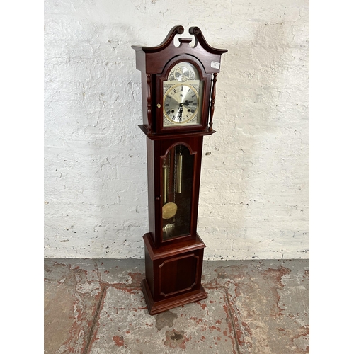 95 - A mahogany cased 31 day granddaughter clock with pendulum and weights - approx. 139cm high x 35cm wi... 