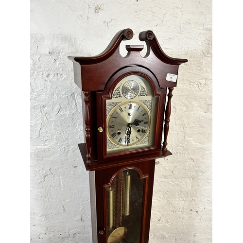 95 - A mahogany cased 31 day granddaughter clock with pendulum and weights - approx. 139cm high x 35cm wi... 