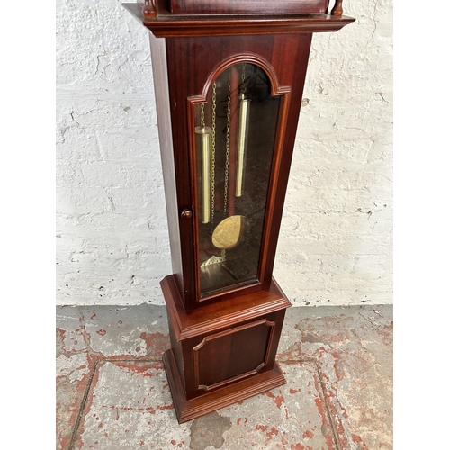 95 - A mahogany cased 31 day granddaughter clock with pendulum and weights - approx. 139cm high x 35cm wi... 