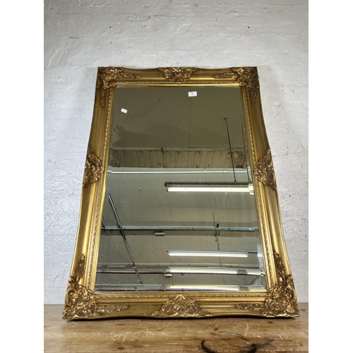 166 - A 19th century style gilt framed bevelled edge wall mirror - approx. 75cm high x 108cm wide