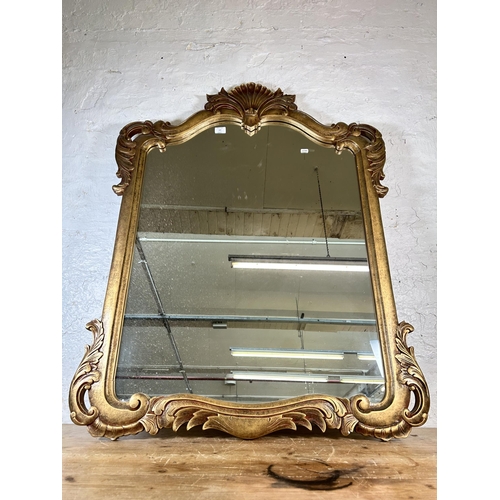 167 - A Rococo style gilt framed wall mirror - approx. 120 cm high x 90cm wide