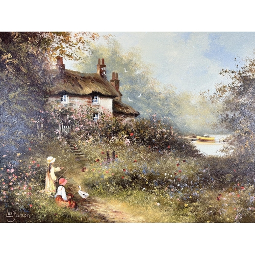 174 - A gilt framed oil on canvas of a cottage scene signed lower left 'Les Parson' - approx. 54cm high x ... 