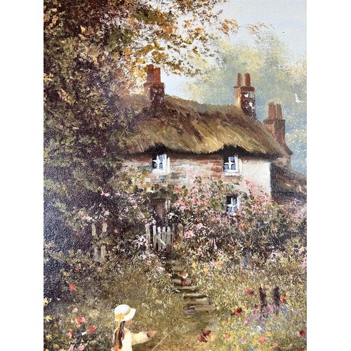 174 - A gilt framed oil on canvas of a cottage scene signed lower left 'Les Parson' - approx. 54cm high x ... 