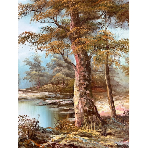 182 - Two mid 20th century gilt framed oil paintings of landscape scenes - largest approx. 64cm high x 90c... 