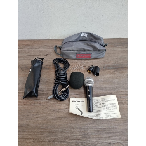 555 - A cased Shure Prologue 14L dynamic microphone with cable and instructions