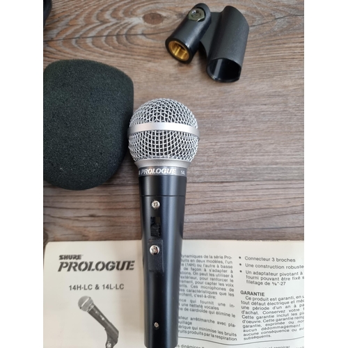 555 - A cased Shure Prologue 14L dynamic microphone with cable and instructions