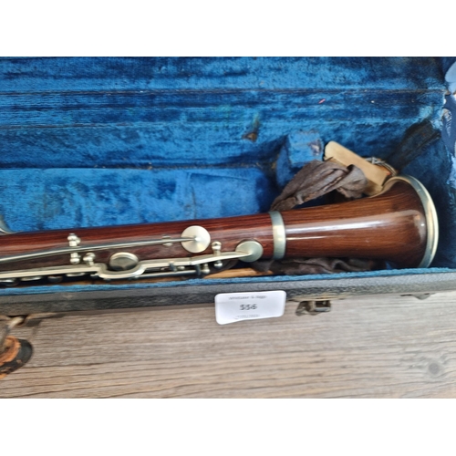 556 - A vintage rosewood E♭ clarinet with Hawkes & Son case and mouthpiece, reeds, cleaning tool etc. - ap... 