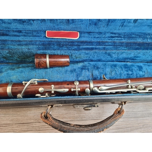 556 - A vintage rosewood E♭ clarinet with Hawkes & Son case and mouthpiece, reeds, cleaning tool etc. - ap... 