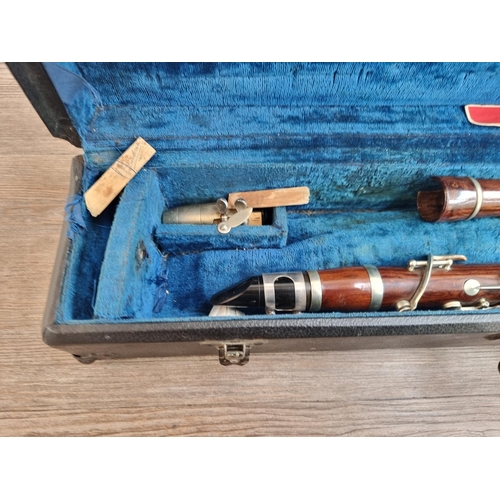 556 - A vintage rosewood E♭ clarinet with Hawkes & Son case and mouthpiece, reeds, cleaning tool etc. - ap... 