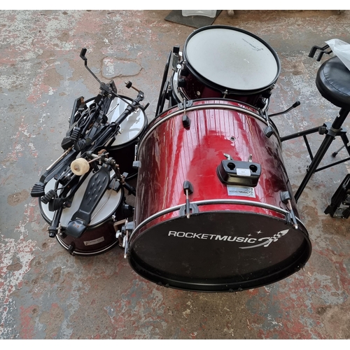 557 - A Rocket Music five piece drum kit with hardware