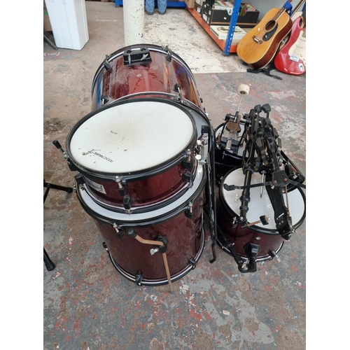 557 - A Rocket Music five piece drum kit with hardware