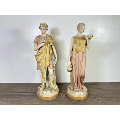 255 - A pair of Art Nouveau Royal Dux porcelain figurines with pink triangle back stamp and impressed numb... 