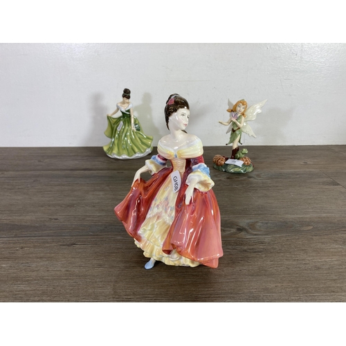 258 - Five Royal Doulton ceramic figurines to include Disney Fairies Beck, Flower of the Month December - ... 