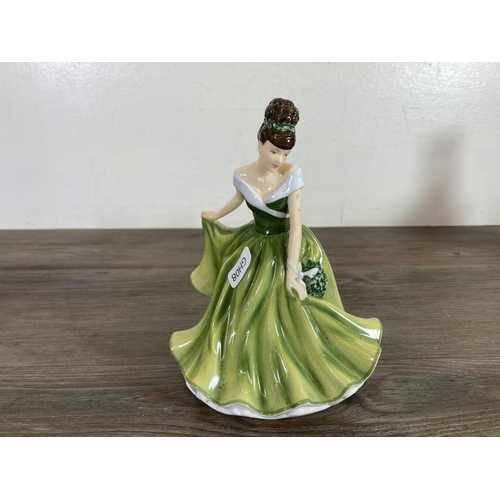 258 - Five Royal Doulton ceramic figurines to include Disney Fairies Beck, Flower of the Month December - ... 