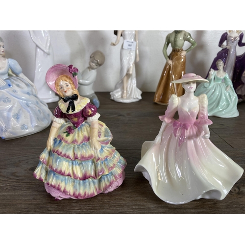 267 - Fourteen ceramic figurines to include Royal Doulton The Old Balloon Seller, Nao by Lladro, Royal Wor... 