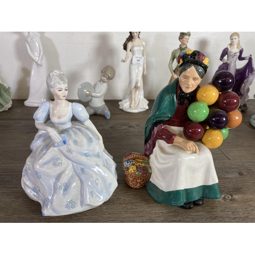 267 - Fourteen ceramic figurines to include Royal Doulton The Old Balloon Seller, Nao by Lladro, Royal Wor... 