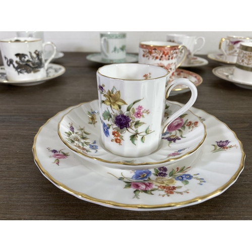 274 - A collection of ceramic cups and saucers to include Feltmann Weider hand painted trio, Royal Crown D... 