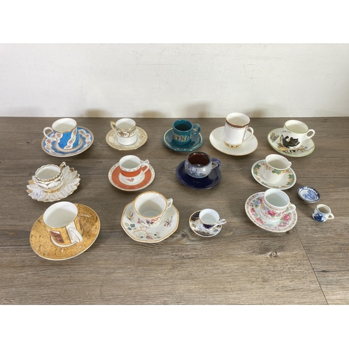 279 - Fourteen ceramic cups and saucers to include Wedgwood Devon Rose, Noritake, Coalport The gilded coff... 