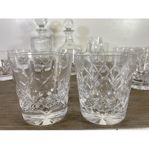 290 - Approx. twenty eight pieces of cut crystal glassware to include two decanters, whisky tumblers etc.