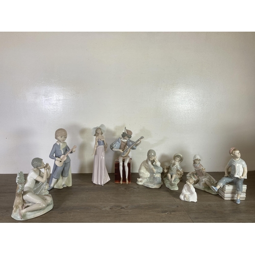 296 - Nine Spanish porcelain figurines to include Lladro, Nao etc.