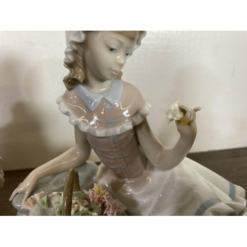 296 - Nine Spanish porcelain figurines to include Lladro, Nao etc.