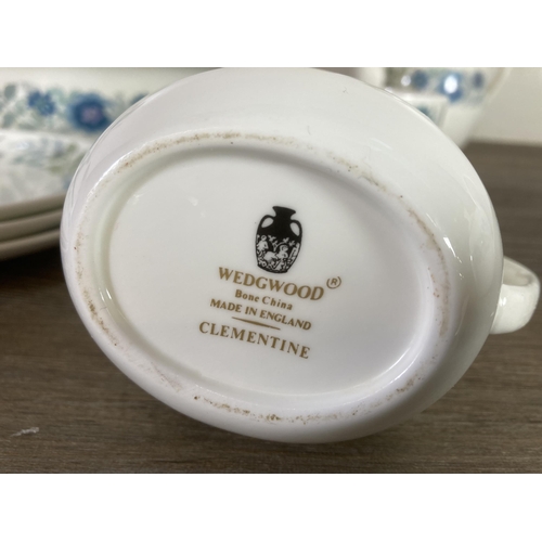 297 - A large collection of Wedgwood Clementine bone china dinnerware