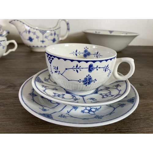 299 - A large collection of Denmark pattern fine bone china to include Mason's, Furnivals etc.